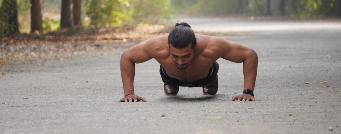 a person squatting on the ground